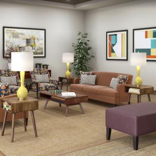 A modern living room with stylish furniture, bright lamps, and colorful artwork.