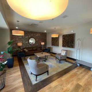 A stylish and inviting living room featuring modern furniture and warm lighting.
