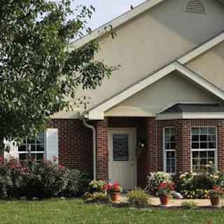 A charming suburban house with well-maintained landscaping.