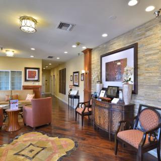 A well-decorated waiting area featuring comfortable seating and elegant decor.
