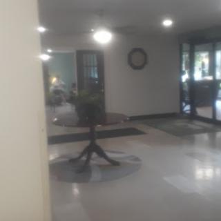A view of the lobby with furniture and soft lighting.