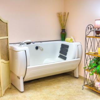 A luxurious bathroom with a modern bathtub and elegant decor.
