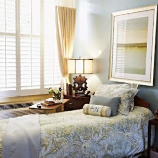 A cozy and beautifully designed bedroom featuring soft colors, elegant bedding, and a warm ambiance.