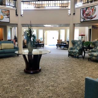 A spacious and elegantly decorated lobby with comfortable seating areas.