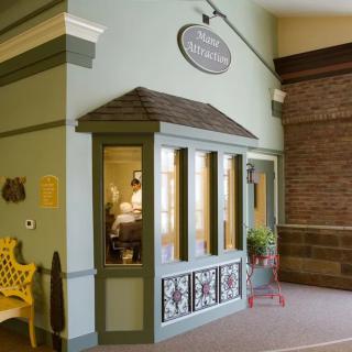A vintage-style indoor storefront with decorative elements and classic architecture.