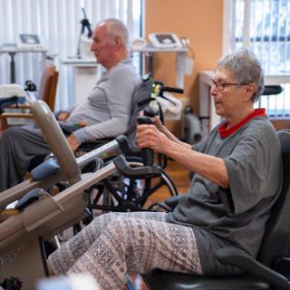 Seniors engaging in exercise therapy at a rehabilitation center.