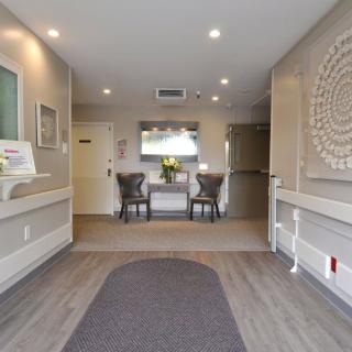 A modern interior lobby with seating and decorative artwork.