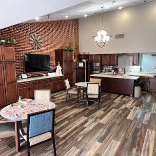 A contemporary kitchen and dining space featuring a blend of wood cabinetry and stylish furnishings.