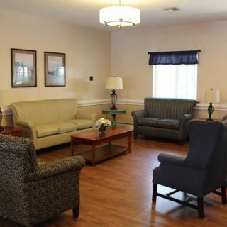 A cozy living room with comfortable seating and elegant decor.