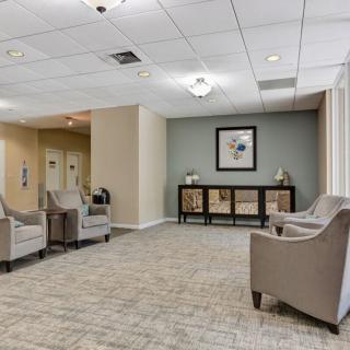 A well-lit lobby area with comfortable seating and tasteful decor.