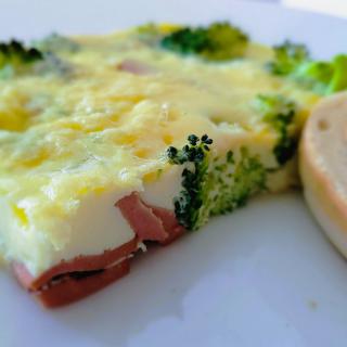 A delicious omelette with broccoli and cheese, served on a plate.