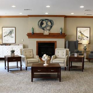 A cozy living room with comfortable seating and elegant decor.