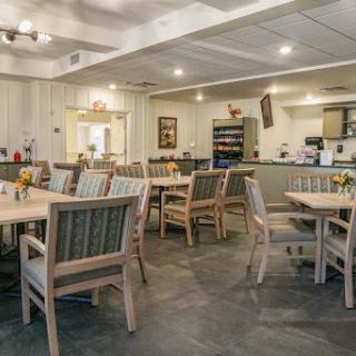A cozy dining area featuring wooden furniture and a welcoming atmosphere.