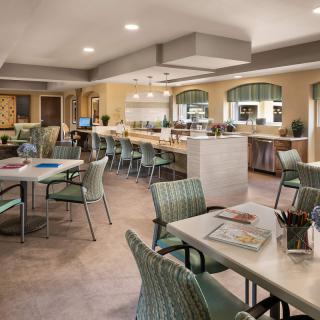 A modern cafe interior with ample seating and stylish decor.