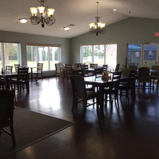 A spacious and inviting dining area with multiple tables and natural light.
