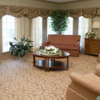 A cozy living room with elegant furniture and decor.