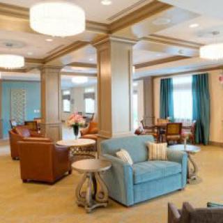 A modern lounge area with comfortable seating and elegant lighting.