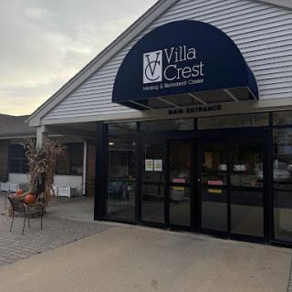 Entrance to Villa Crest with blue awning.
