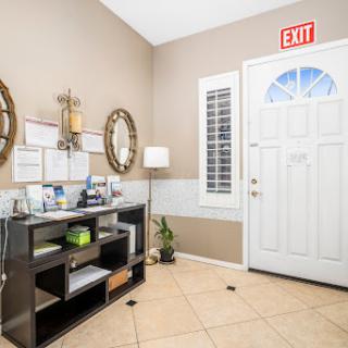 A welcoming entrance featuring modern decor, a stylish console table, and natural light.