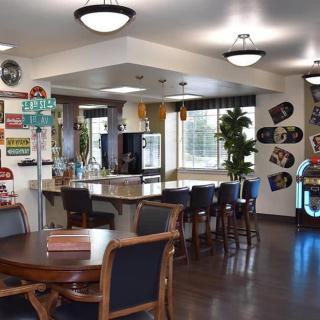 Cozy diner interior with vintage decor and bar seating.