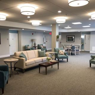 A modern lounge area with comfortable seating and stylish lighting.