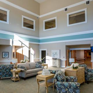 A spacious and inviting lobby area featuring comfortable seating, modern decor, and ample natural light.