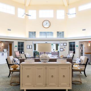 A well-lit lobby with comfortable seating and elegant decor.