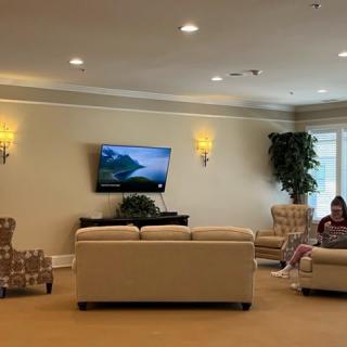 A quiet lobby with comfortable seating and a television.