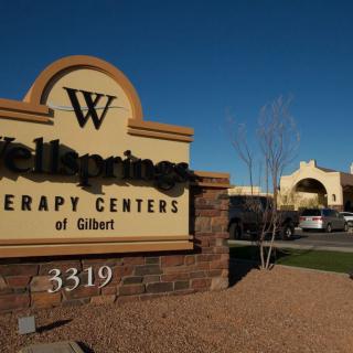 Sign for Wellbeing Therapy Centers of Gilbert in an outdoor setting.