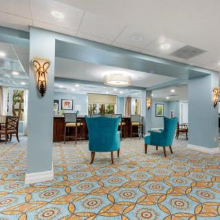 A spacious lobby area featuring comfortable seating and elegant decor.