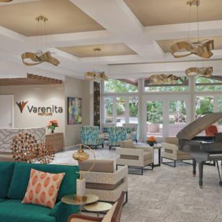 A modern hotel lobby with stylish furniture and elegant lighting.