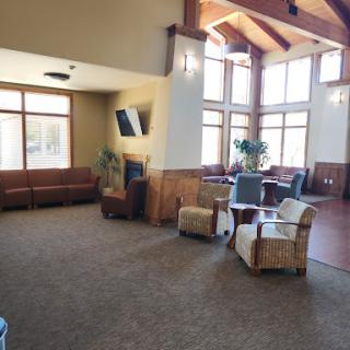 A spacious and inviting lobby featuring comfortable seating and ample natural light.
