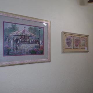 Framed artwork displayed on a gallery wall.