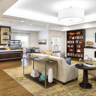 A modern living room with comfortable seating and elegant decor.
