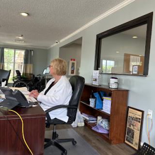 A woman working at her desk in a modern office environment.