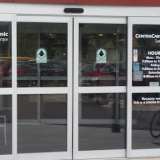 Entrance of a commercial building featuring glass double doors.