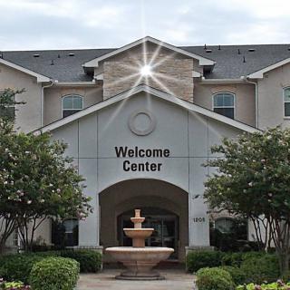 A welcome center with a fountain at the entrance.