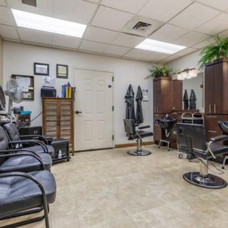 A well-organized hair salon with styling and waiting areas.