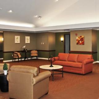 A spacious lobby with comfortable seating and tasteful artwork.