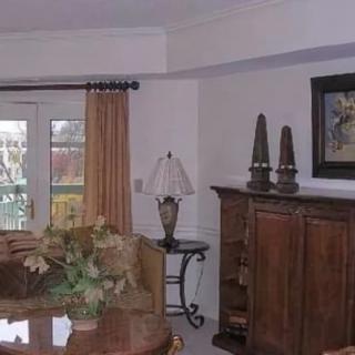 A cozy living room with elegant furnishings and decor.