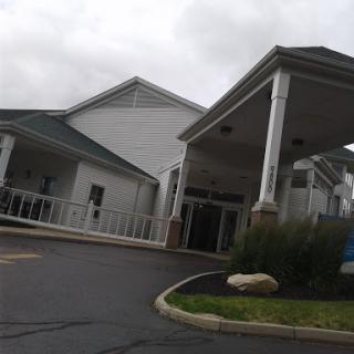 A view of a building entrance on a cloudy day.