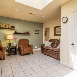 A cozy living room with leather furniture and decorative elements.