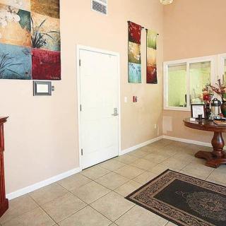 Lobby area with wall artwork and decorative table.