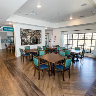 A modern dining area with wooden floors and stylish decor.
