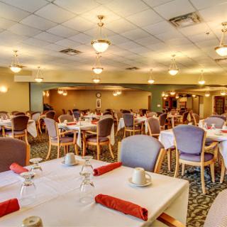 A spacious and elegantly arranged dining room ready for guests.