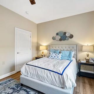 Cozy bedroom with stylish decor and neutral colors.