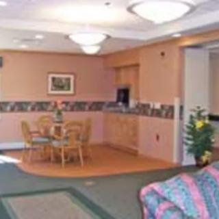 A cozy living room with a small dining area and comfortable seating arrangement.