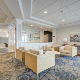 A modern lounge area featuring comfortable seating and elegant decor.