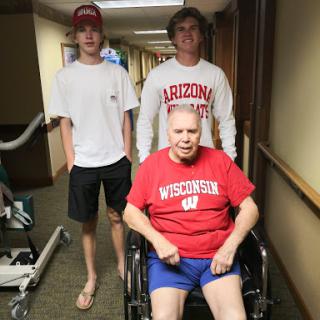 A family moment in a hospital corridor, showcasing support and togetherness.