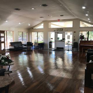 A spacious and inviting lobby featuring modern furniture and ample natural light.